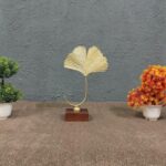 Golden Metal Zingo Leaf On Wooden Stand For Home Decoration